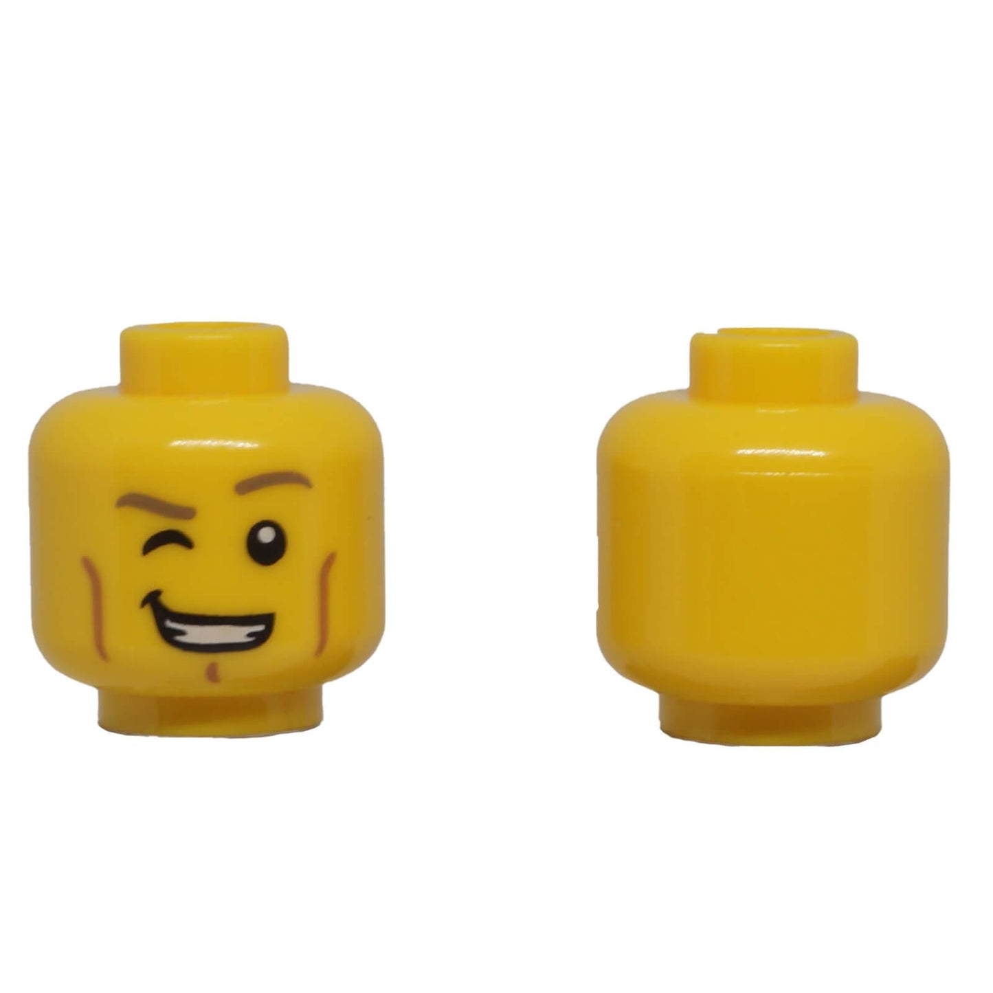 LEGO® classic yellow minifigure head with one eye winking, lopsided smile, cheek lines and chin dimple.