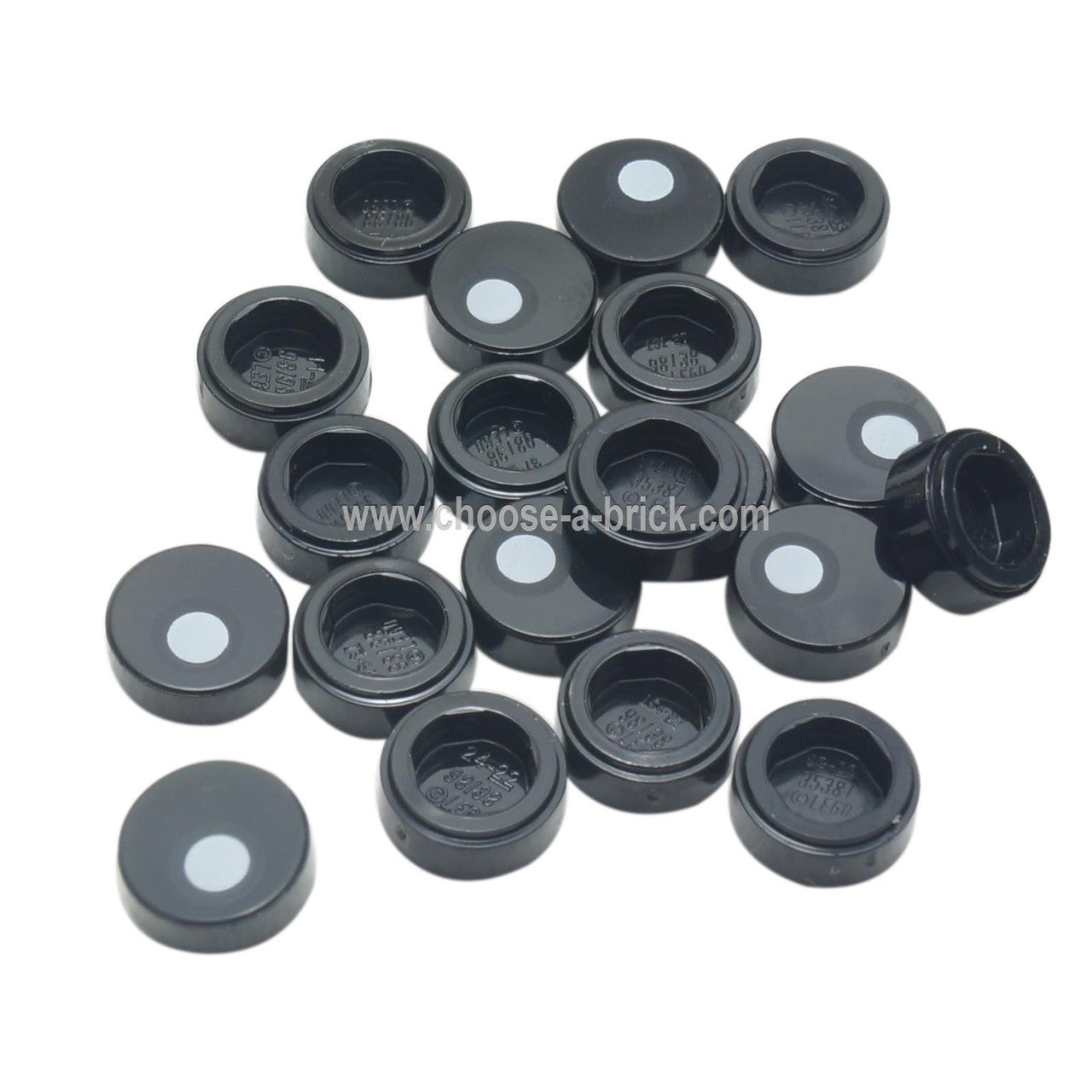 LEGO Black Round 1x1 Tile with Eye Pupil, pile showing top and bottom views