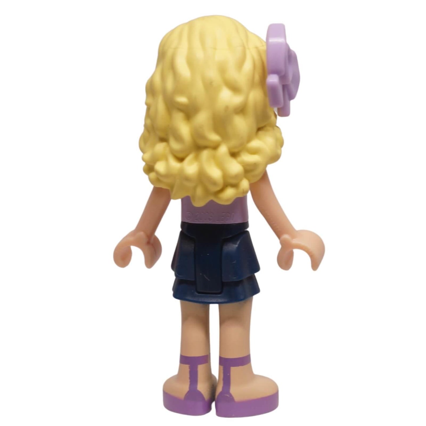 LEGO Friends Danielle mini-doll frnd0049 with lavender floral top, layered skirt, and bow hairpiece. From Downtown Bakery set, ideal for collections. Back profile