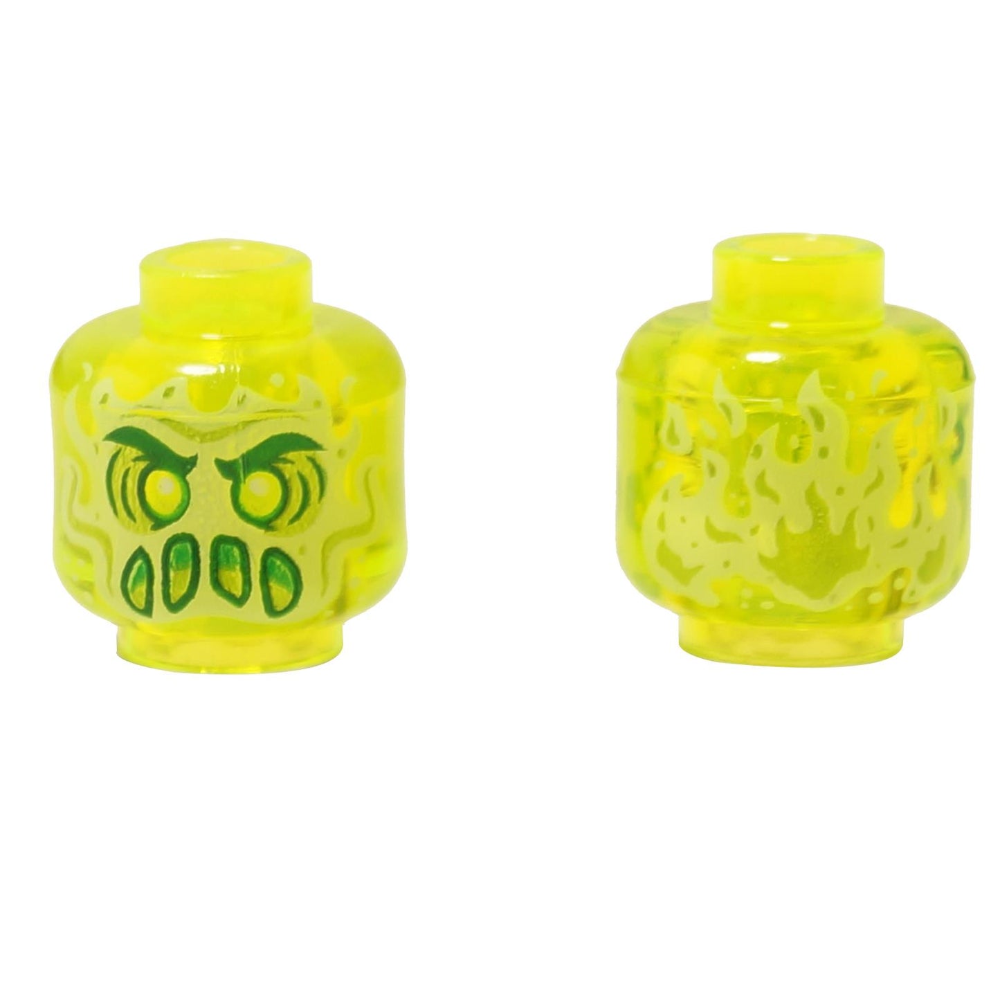 Front and alternate side views of the LEGO® minifigure head (3626pb2435) in transparent bright yellow, featuring an alien ghost face with glowing green eyes, fang-like mouth details, and translucent flame patterns wrapping around the sides.