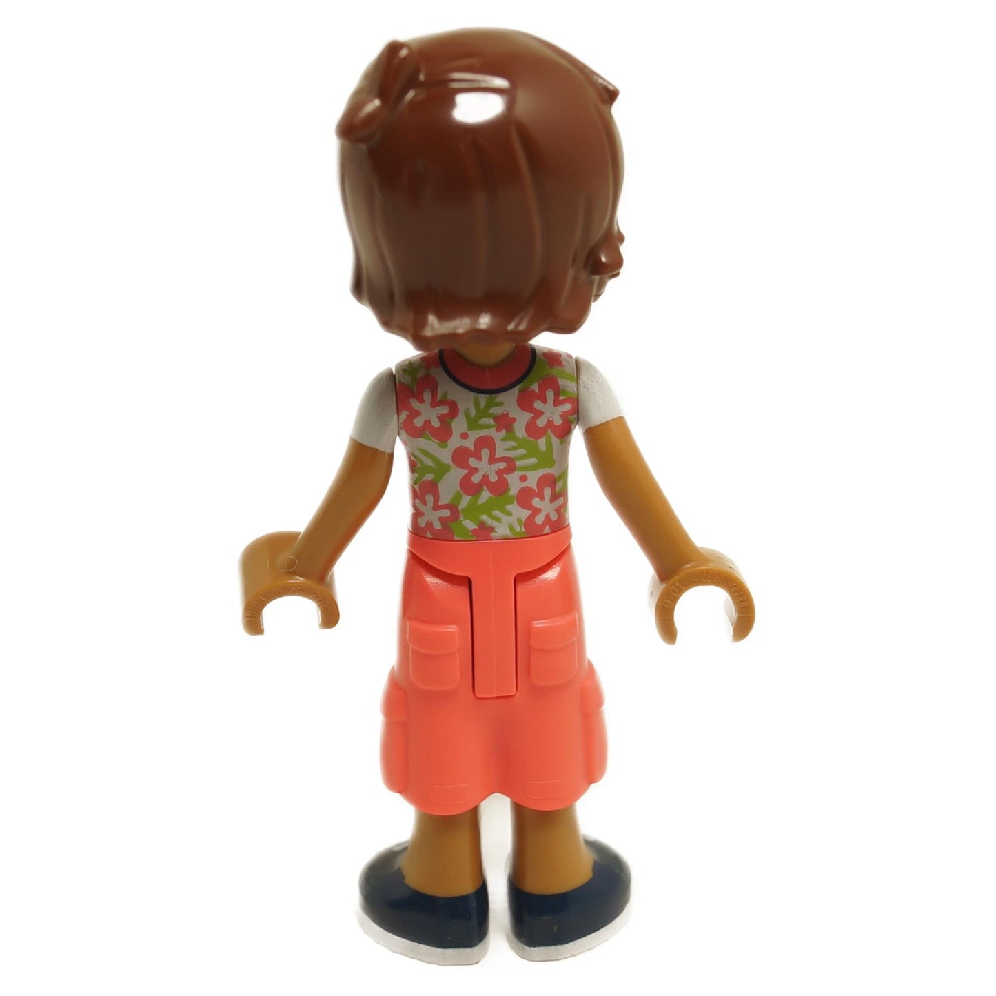 Back view of LEGO® Friends Leo mini-doll frnd712 with white shirt printed with coral flowers and coral cropped trousers with large pockets