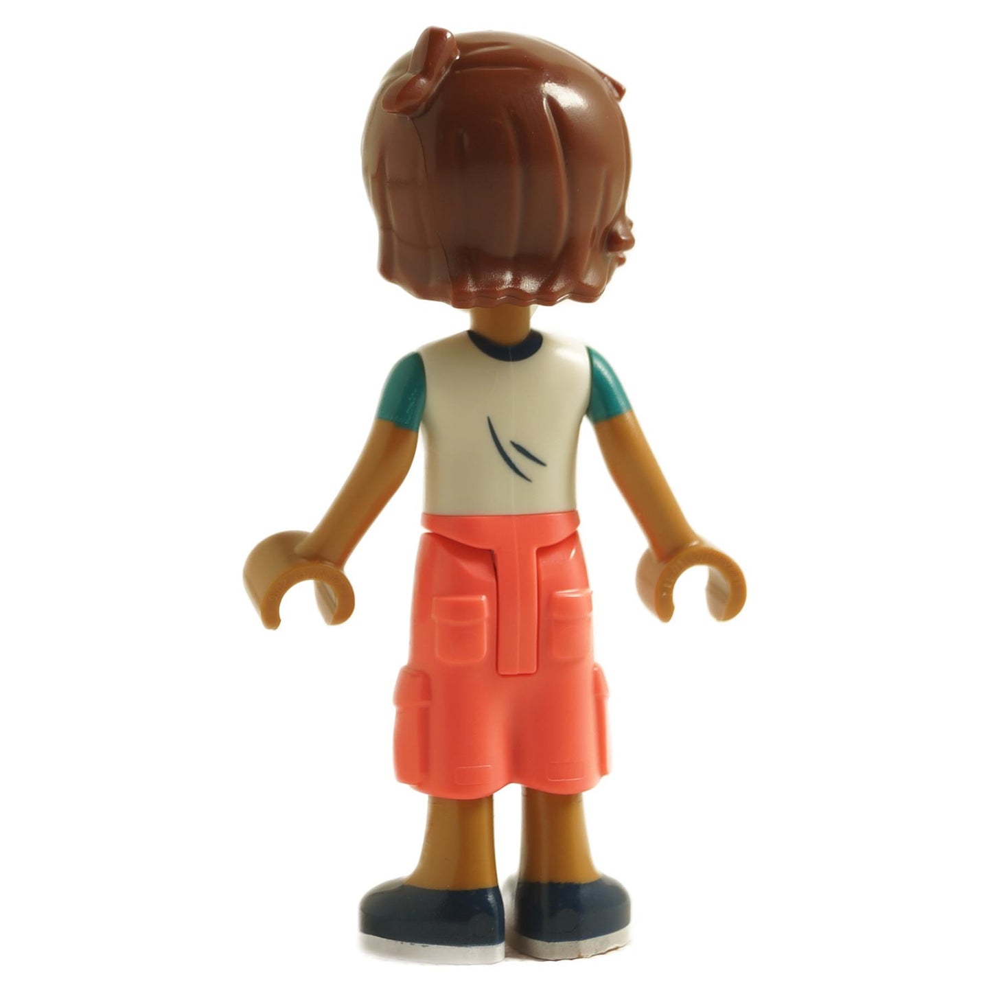 back view of LEGO Friends Leo mini doll with brown hair wearing white t-shirt coral cropped trousers and dark blue shoes