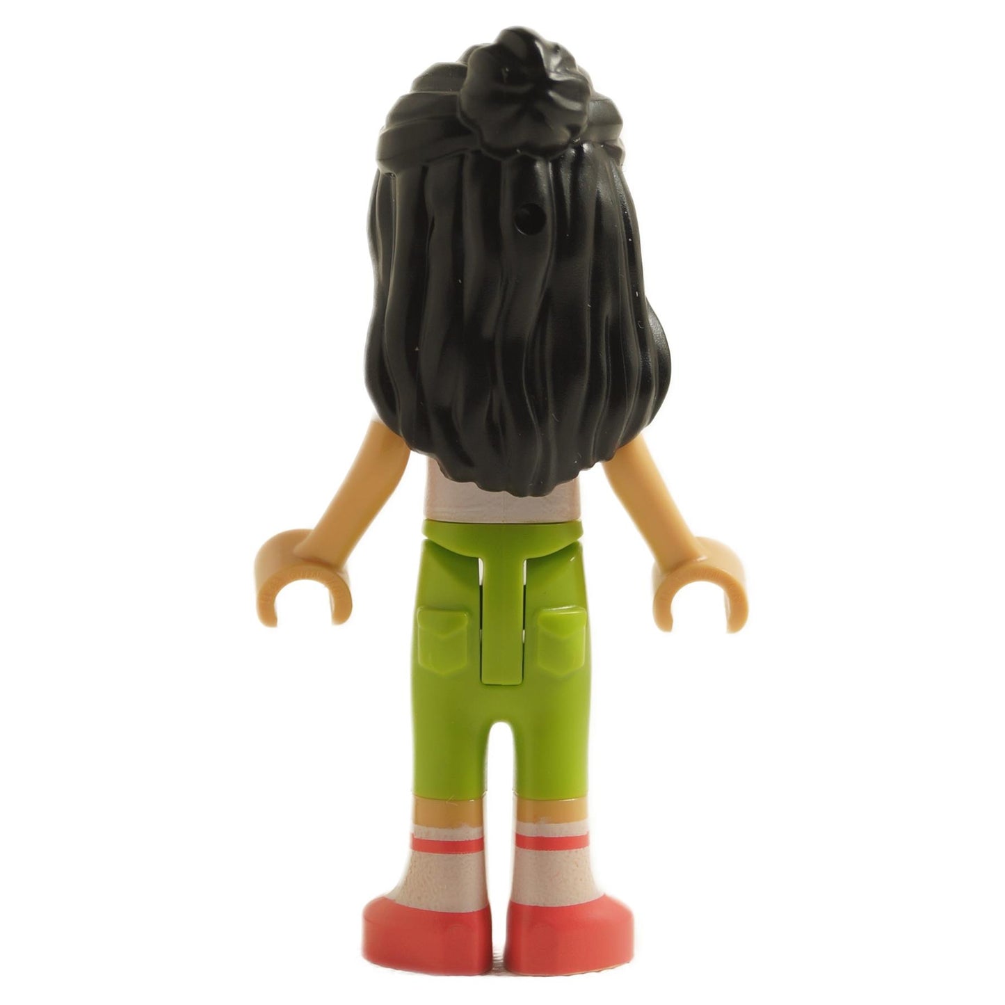 back view of LEGO Friends Liann mini doll with long black hair wearing white knotted t-shirt green trousers white socks and red shoes