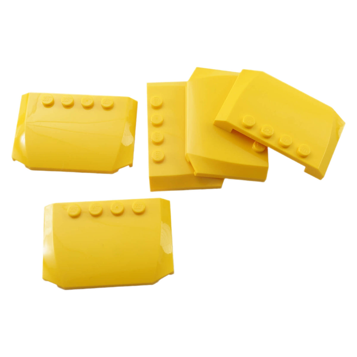 Yellow LEGO® Part 52031 Wedge 4 x 6 x 2/3 Triple Curved with a smooth rounded surface, tapered profile and visible studs