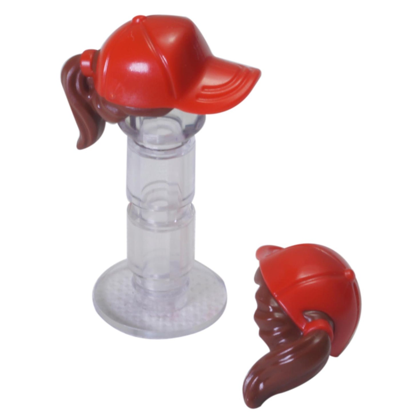 LEGO® minifigure hair piece with red ball cap and brown ponytail, molded headgear hair accessory