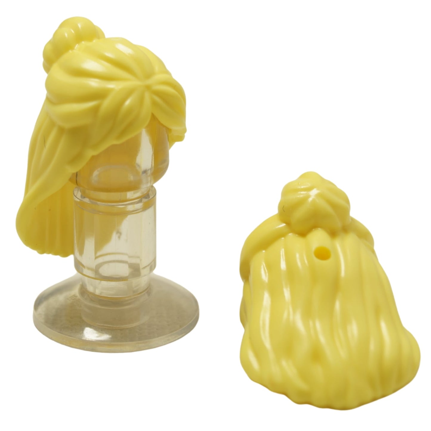LEGO Mini Doll hajtartozék 2633 női hosszú, hátra fésült bun frizurával, kiegészítő nyílással világos sárga színben.