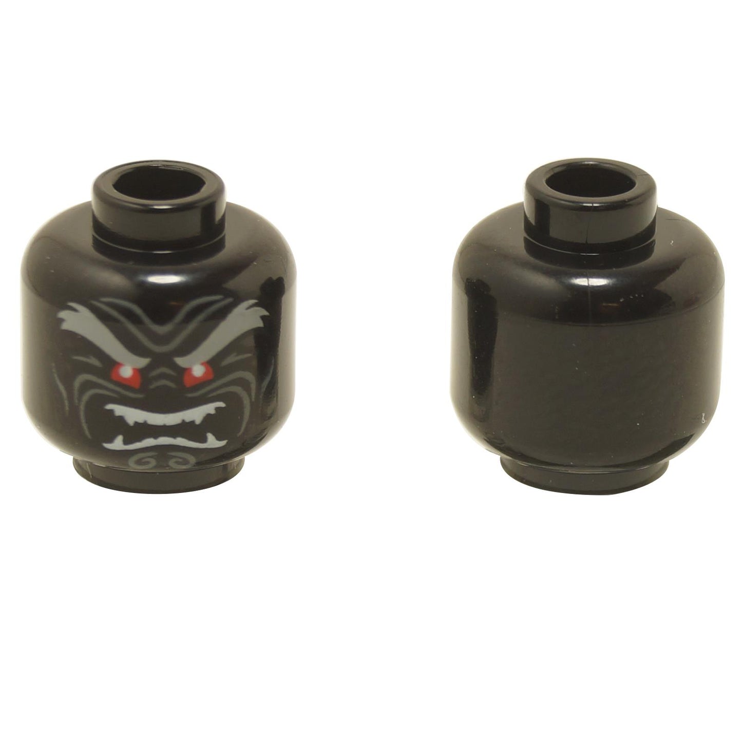 Front and back views of the LEGO® minifigure head (3626pb2296) in black, featuring an evil face with red eyes, sharp fangs, and grey eyebrows, with the reverse side left plain.