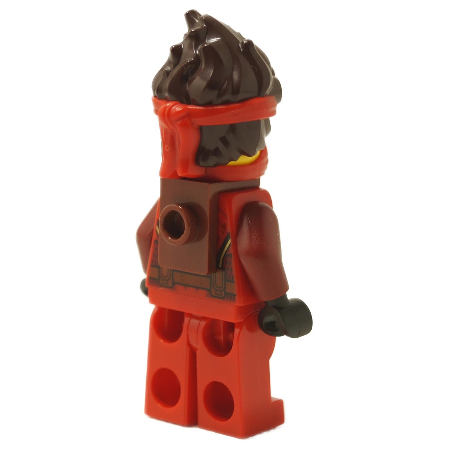 Back view of the LEGO Kai minifigure, showing dark brown printing detail on the back of the red torso and back attachment socket.