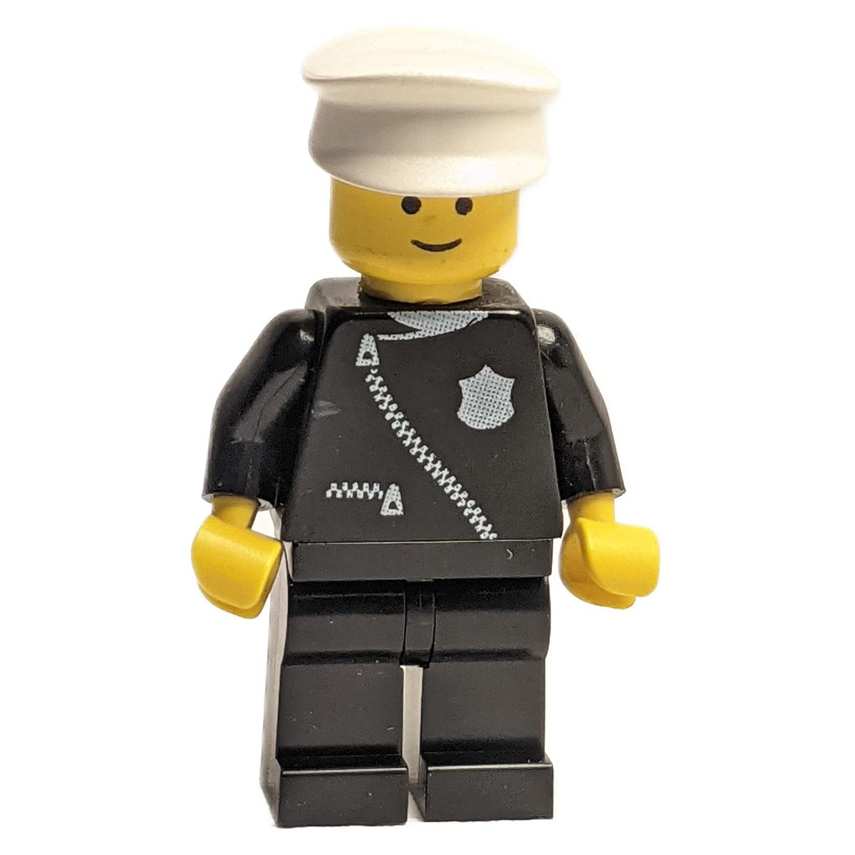 LEGO Police cop013 minifigure in black uniform and white hat.