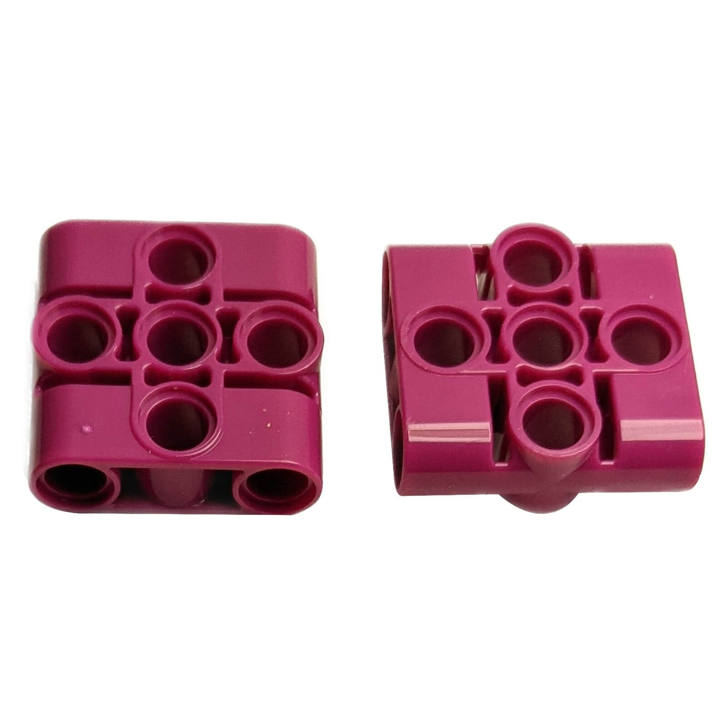 LEGO® Technic Pin Connector Block 3 x 3 with 4 Pins (39793) in magenta, shown side by side on white background