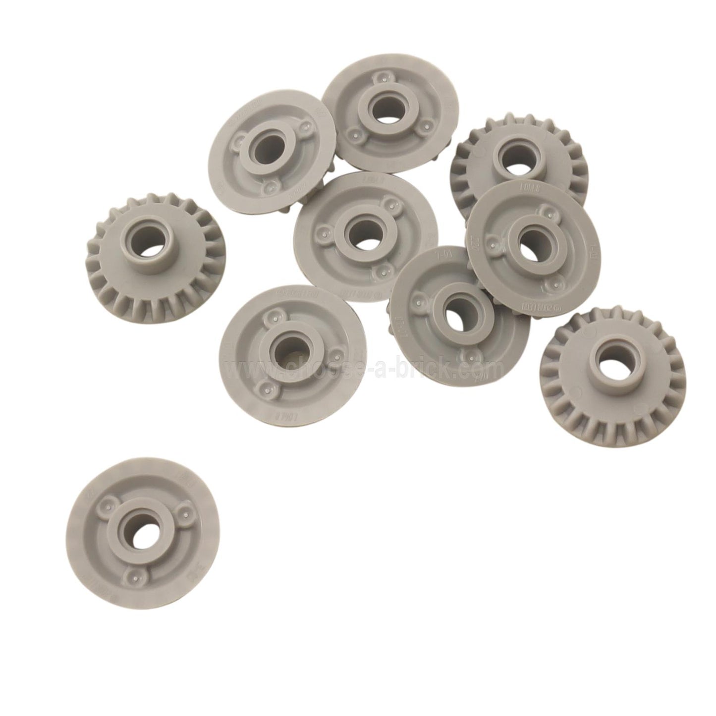 A group of ten light bluish-gray LEGO Technic 20T Bevel Gears (87407) scattered on a white background.