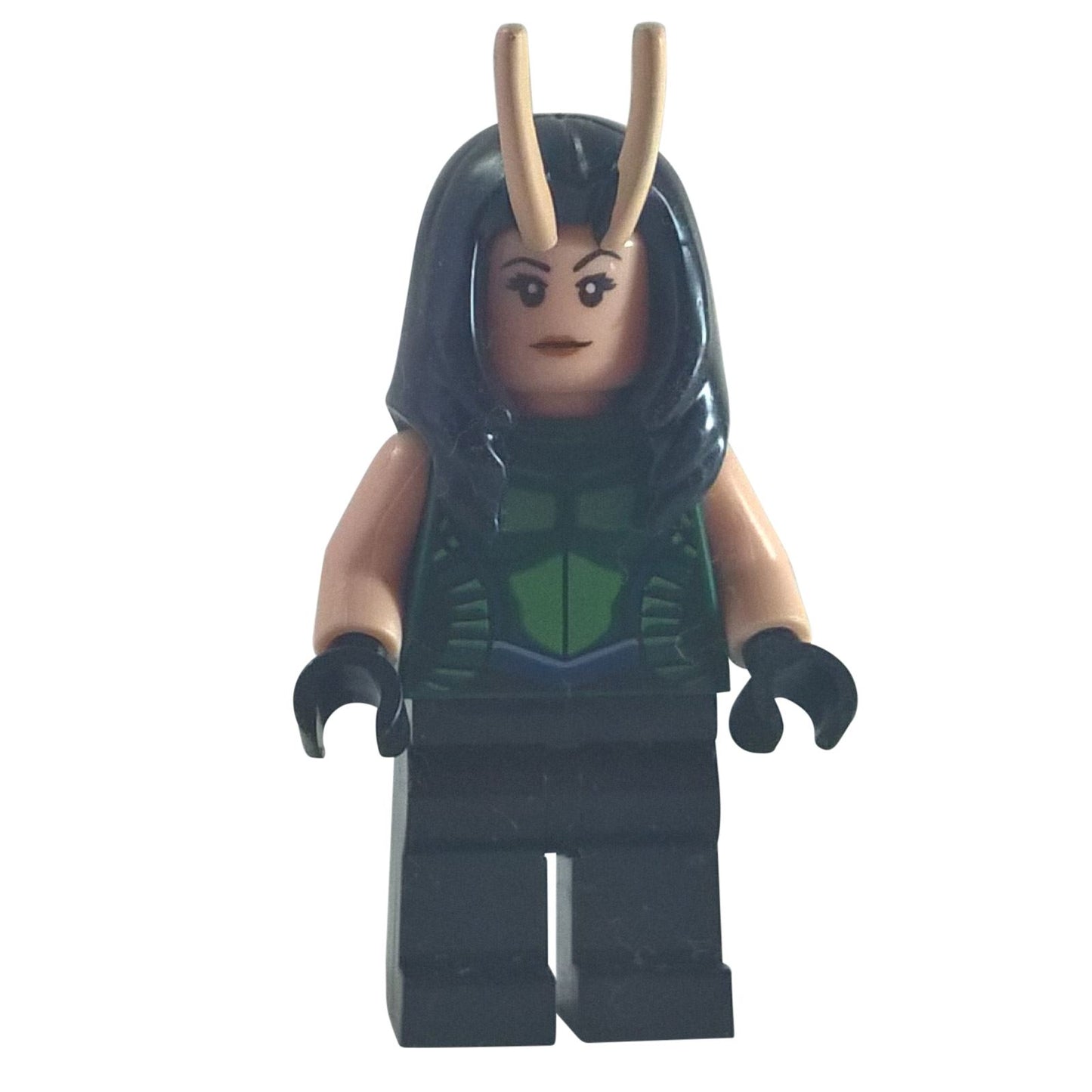 A LEGO® minifigure of Mantis with light nougat skin, black hair with tan antennae, a dark green vest with dark blue trim printed on her torso, light nougat arms, black hands, and black legs, standing against a white background.