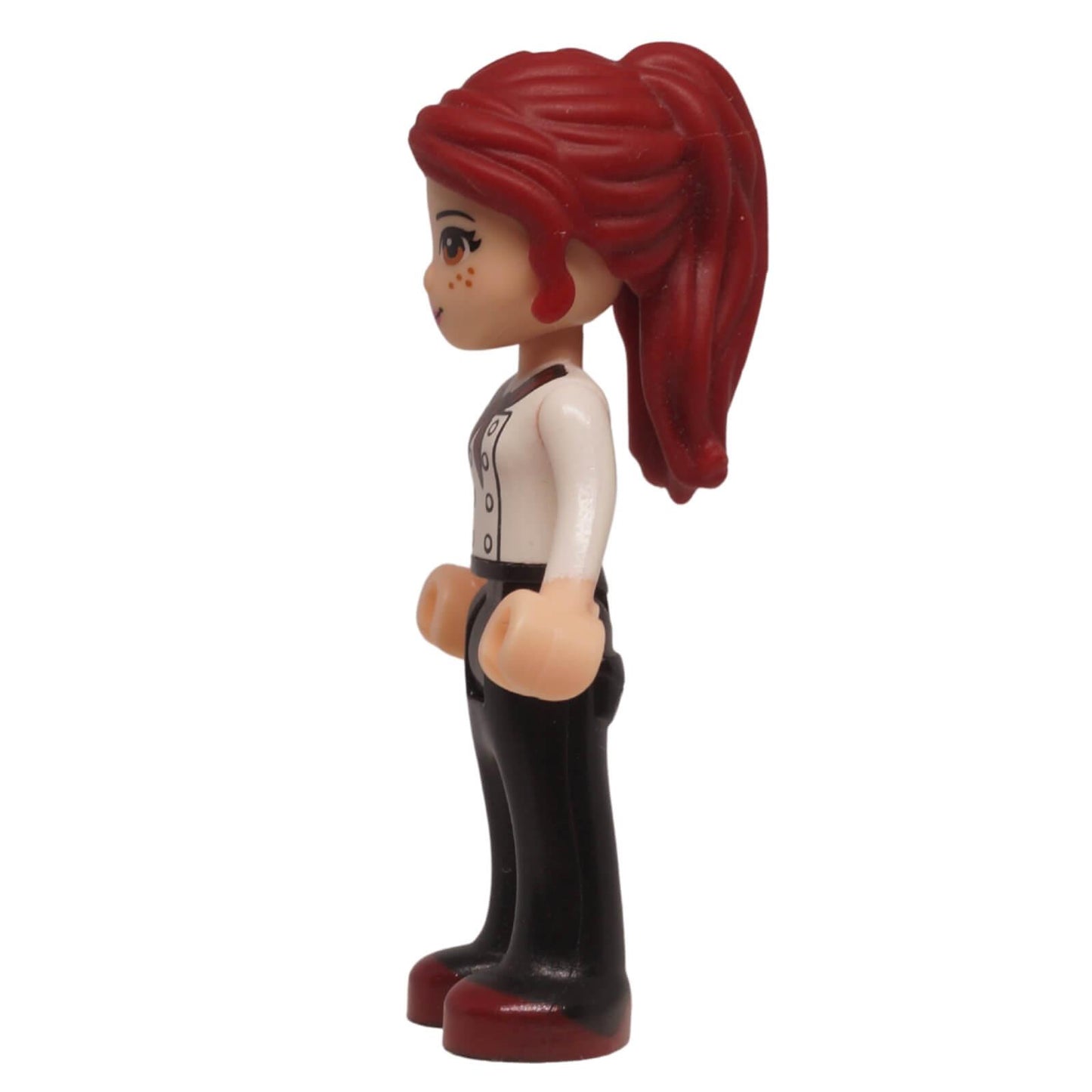 LEGO Friends Mia mini-doll frnd0050 with white top, black trousers, and freckles. From Downtown Bakery set, ideal for character collections. Side profile.