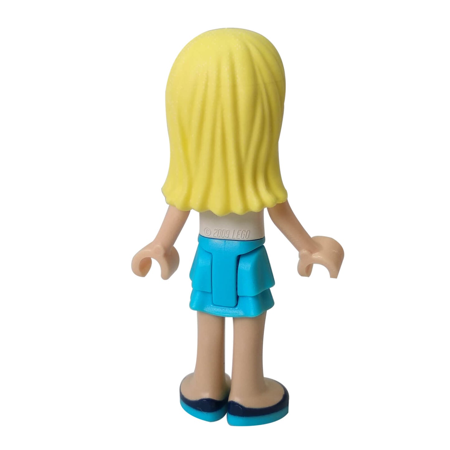 LEGO Stephanie minifigure frnd0171 with white top and azure skirt. back view
