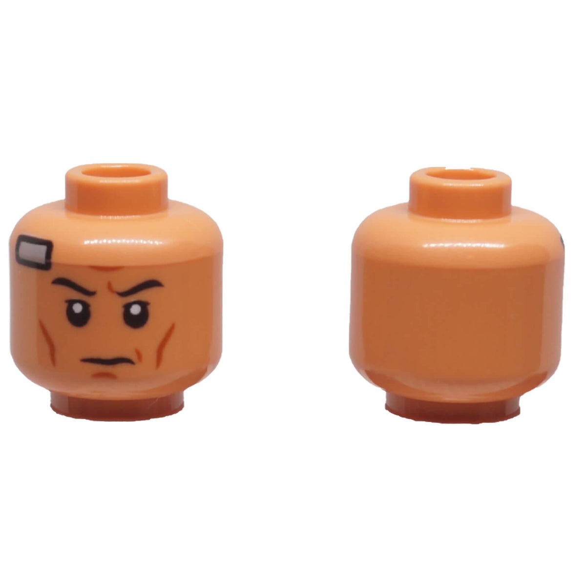 Nougat LEGO® minifigure head 3626pb3489 shown front and back with furrowed eyebrows, stern expression, cheek lines and temple bandage