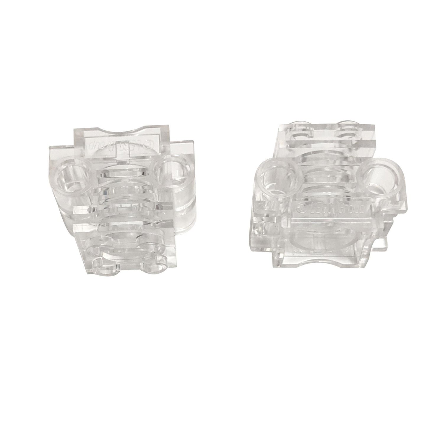 LEGO Technic Engine Cylinder with bottom slots for piston and crankshaft clearance (Part 2850b) in transparent clear.