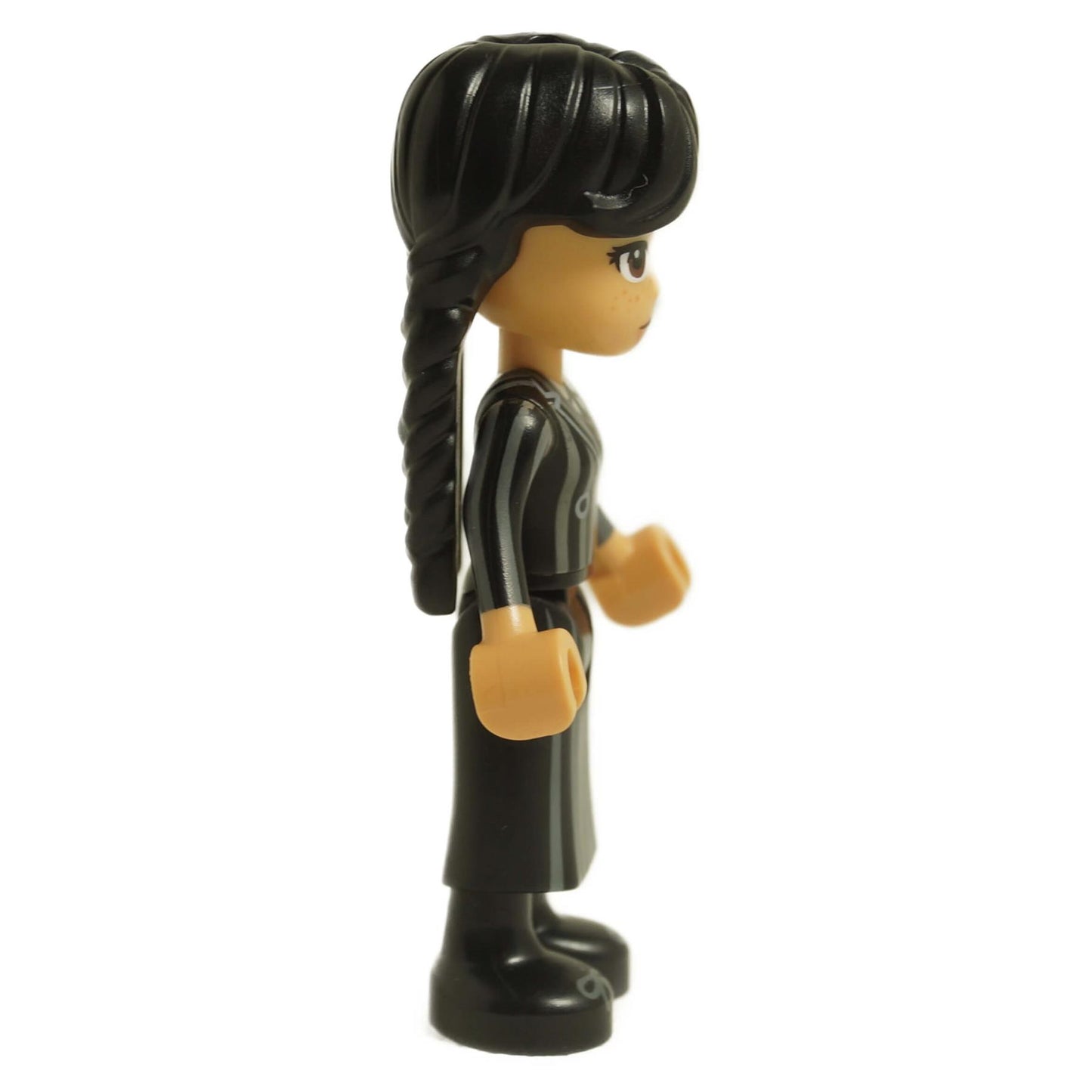 LEGO Wednesday Addams mini doll side view wearing black striped Nevermore school uniform with braided pigtails wed001