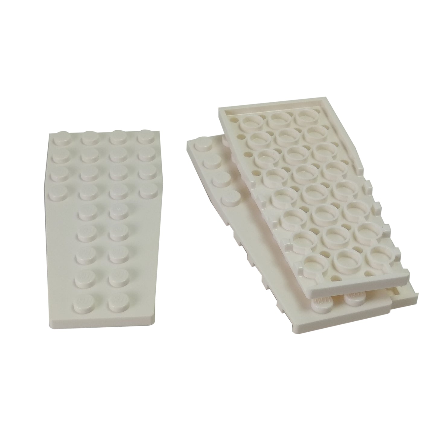 White wedge plate 4 x 9 with stud notches for angled shaping, wings, and custom vehicle builds