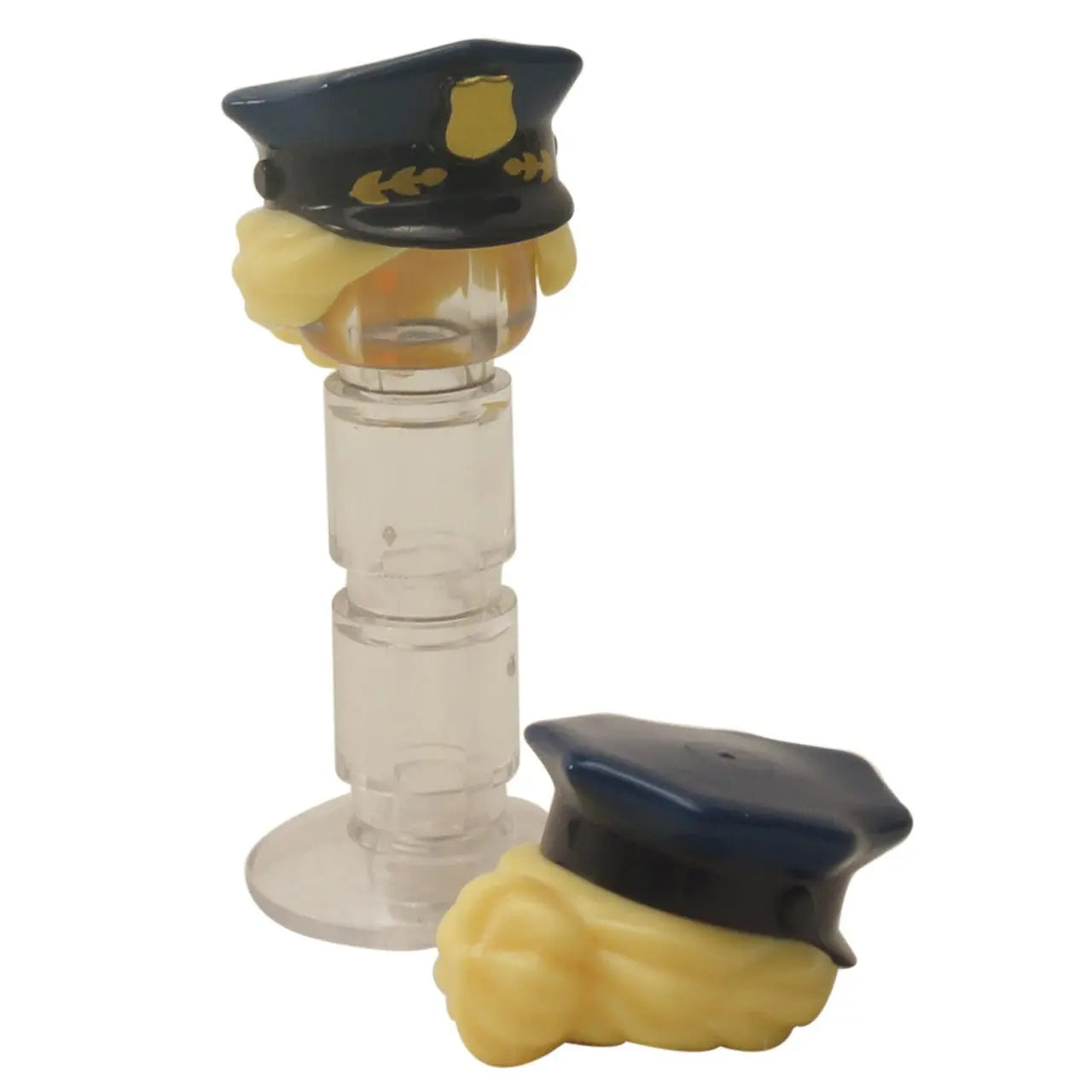 LEGO minifigure blonde hair with dark blue police officer peaked cap and gold badge detailing.