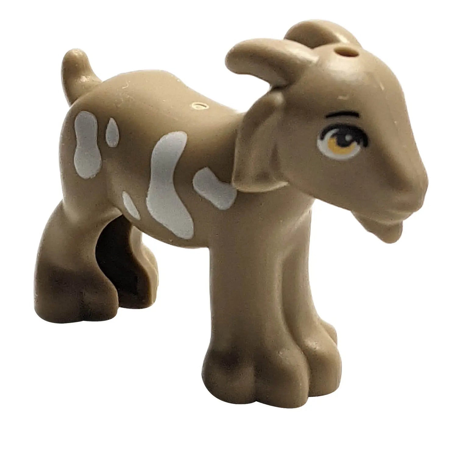 Rare tan LEGO® goat animal figure with white patches, iconic farm creature from the LEGO Animals collection