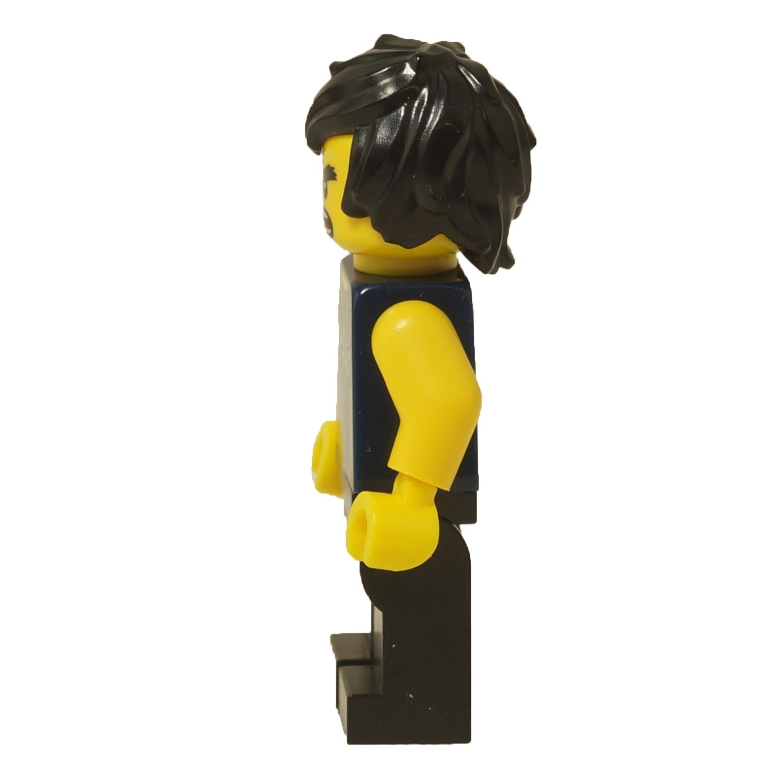 LEGO Cole minifigure (coltlnm08) from The LEGO Ninjago Movie in his casual dark blue sleeveless shirt with a silver graphic, black pants, and an angry expression. Side view.