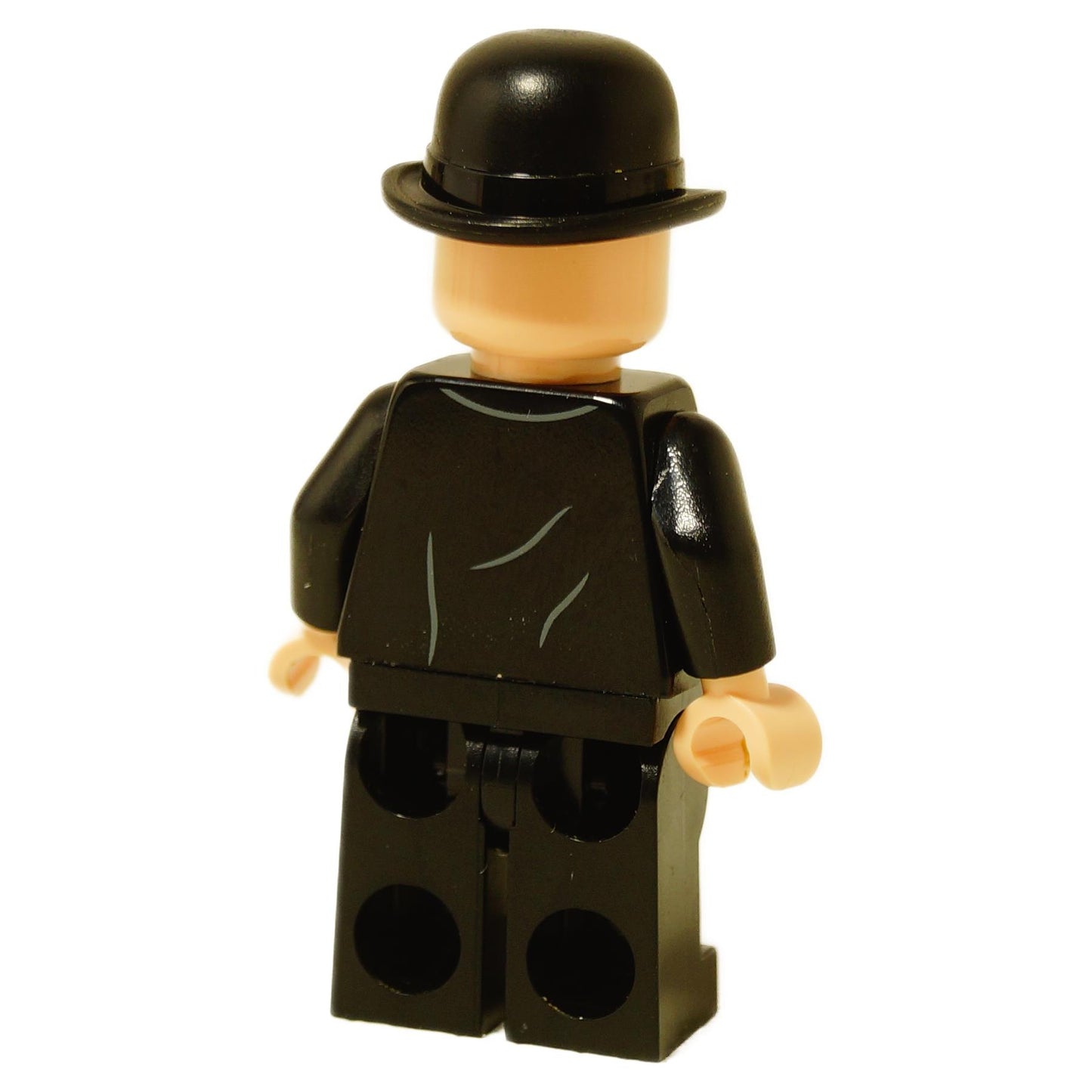 Vista trasera del minifigura de LEGO Cornelius Fudge mostrando la impresión de traje negro liso en el torso y las piernas.