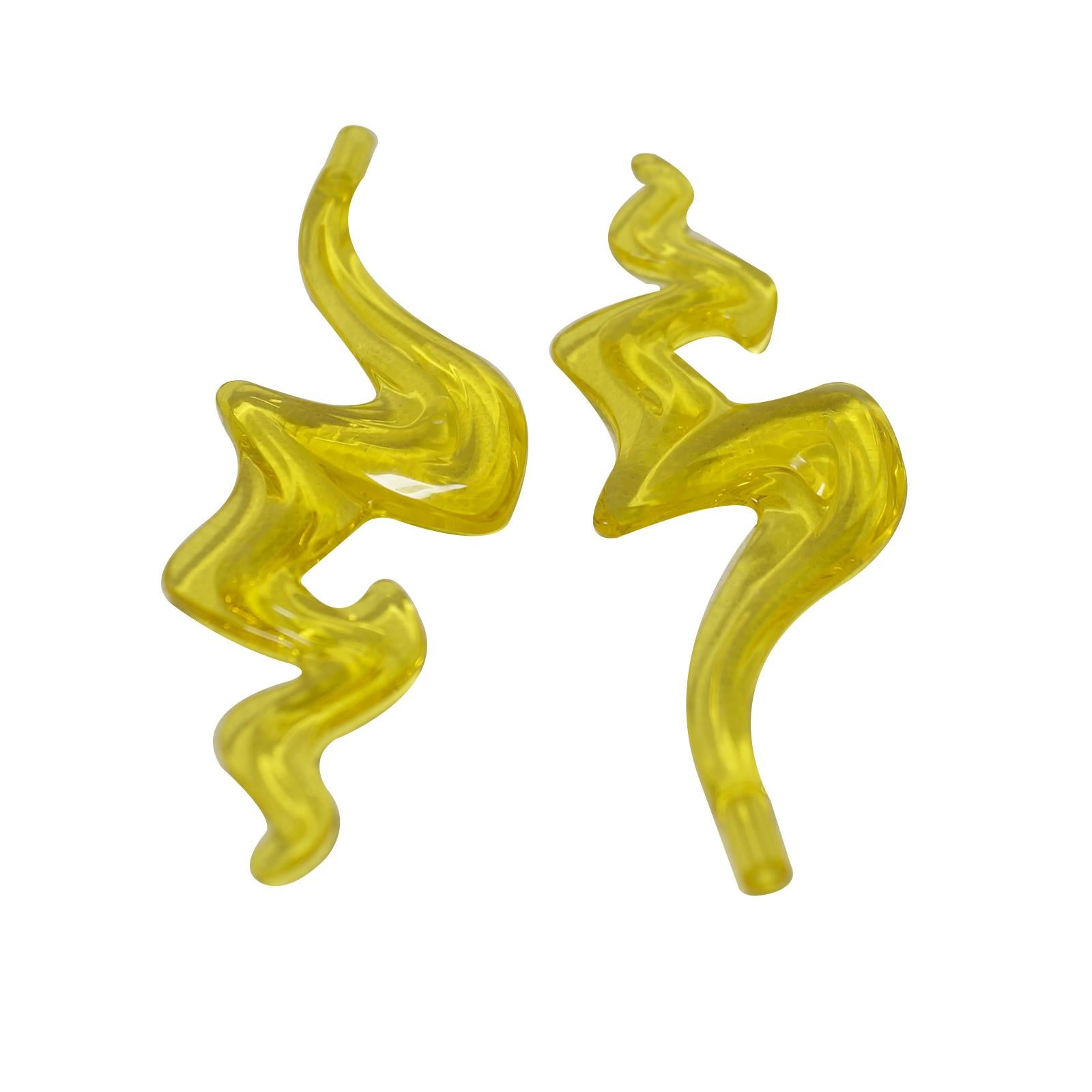 Trans-yellow LEGO® Flame / Wave elements (7105) displayed on a white background.  