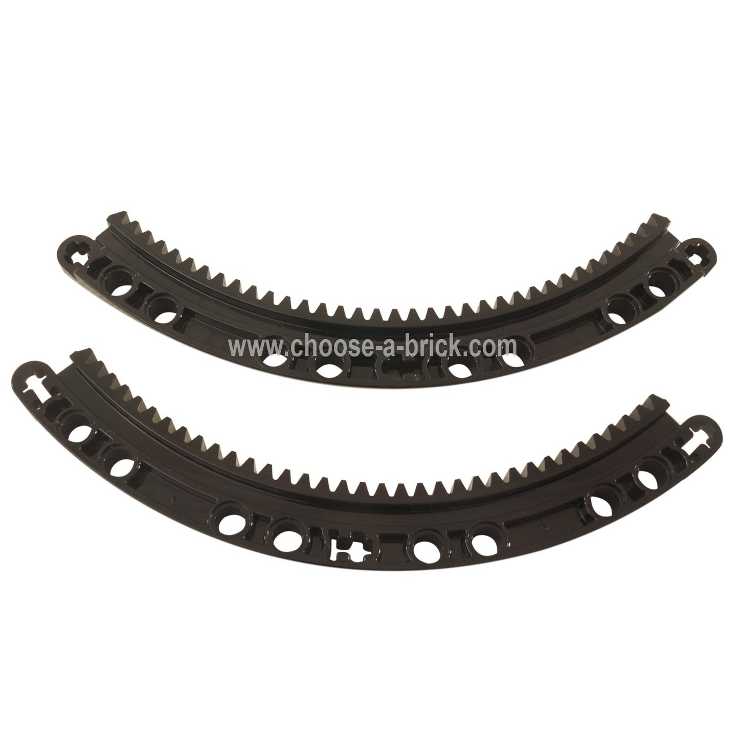 Two black LEGO Technic Curved Gear Rack 11x11 pieces (24121) displaying gear teeth and pin holes.
