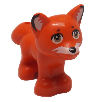 Figura de animal zorro naranja rojizo con ojos impresos y detalle de cola vista frontal.