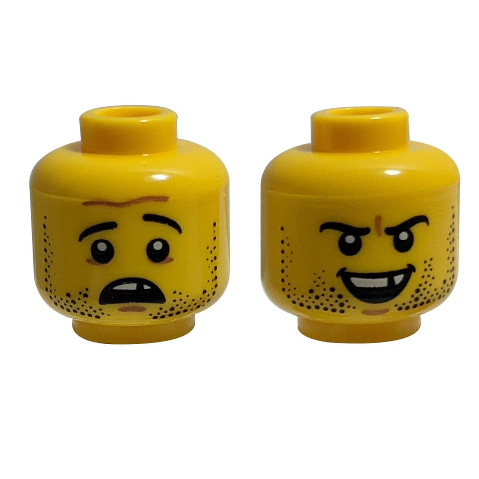 Zweiseitiger LEGO® Minifigur-Kopf mit Stoppeln, einem fehlenden Zahn und einem Grinsen/Schmollen-Ausdruck