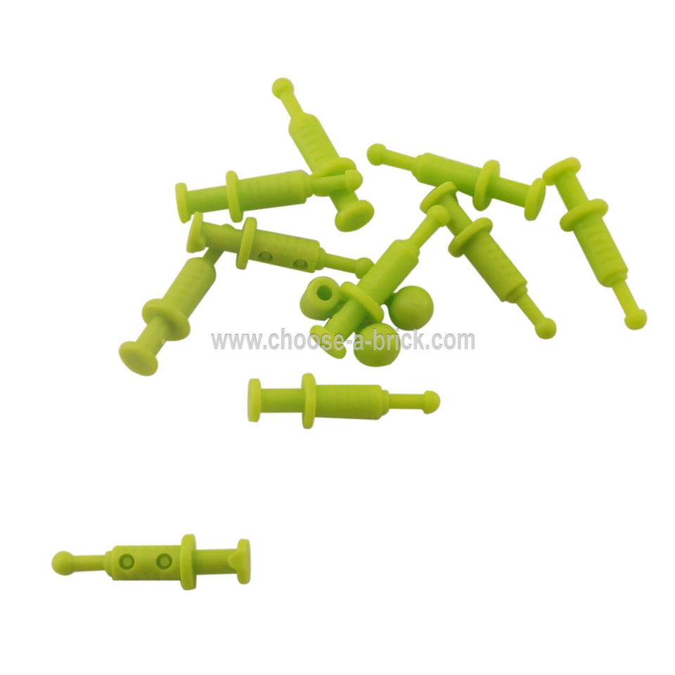 Group of lime green LEGO minifigure syringe accessories (53020) scattered on a white surface.