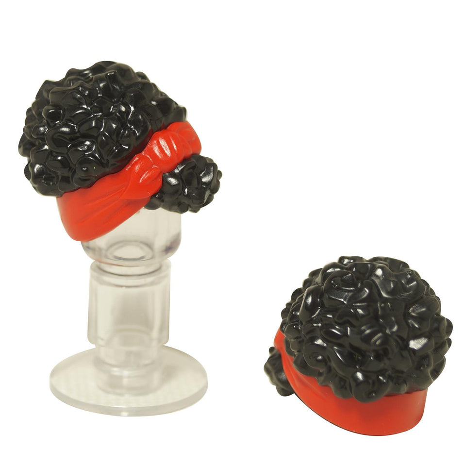 Front and top views of the LEGO® mini-doll hair piece (79984pb04) featuring curly black hair with a red head wrap tied in a knot on the side.