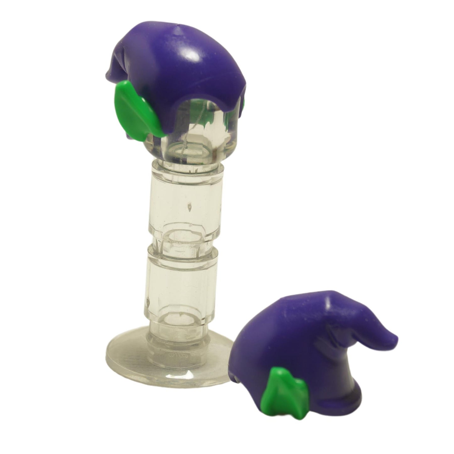 Two LEGO minifigure heads with green pointed ears and purple hats, detached from the body, displayed against a neutral background.