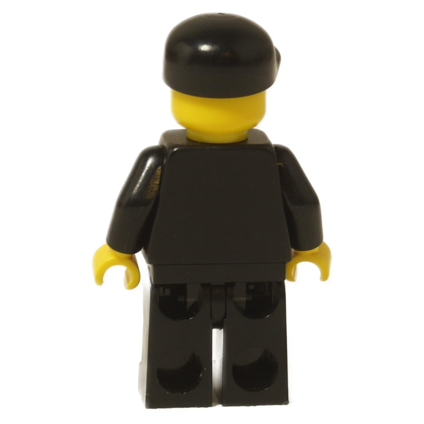 LEGO City Police Officer minifigure (cty0106) wearing a black suit, black cap, and sunglasses with a stubble beard print. Back view.