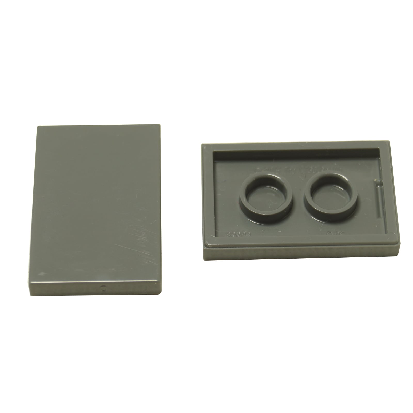 LEGO® Tile 2x3 in durable plastic, in dark bluish gray , perfect for smooth surfaces, flooring, and decorative MOC detailing.
