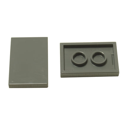 LEGO® Tile 2x3 in durable plastic, in dark bluish gray , perfect for smooth surfaces, flooring, and decorative MOC detailing.
