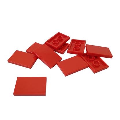 LEGO® Tile 2x3 in durable plastic, in red, perfect for smooth surfaces, flooring, and decorative MOC detailing.
