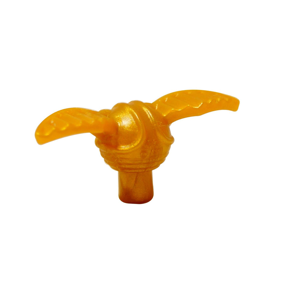 Close-up of a pearl gold LEGO Golden Snitch accessory (37704) with molded wings attached.