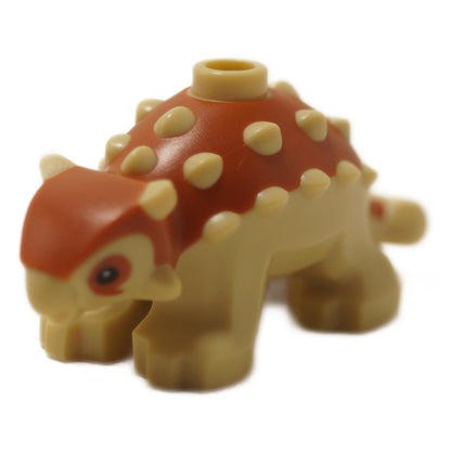 Baby Ankylosaurus Dinosaurfigur mit dunkelorangefarbenen Rückendetails und passenden Augen, kleines geformtes Kreaturenteil