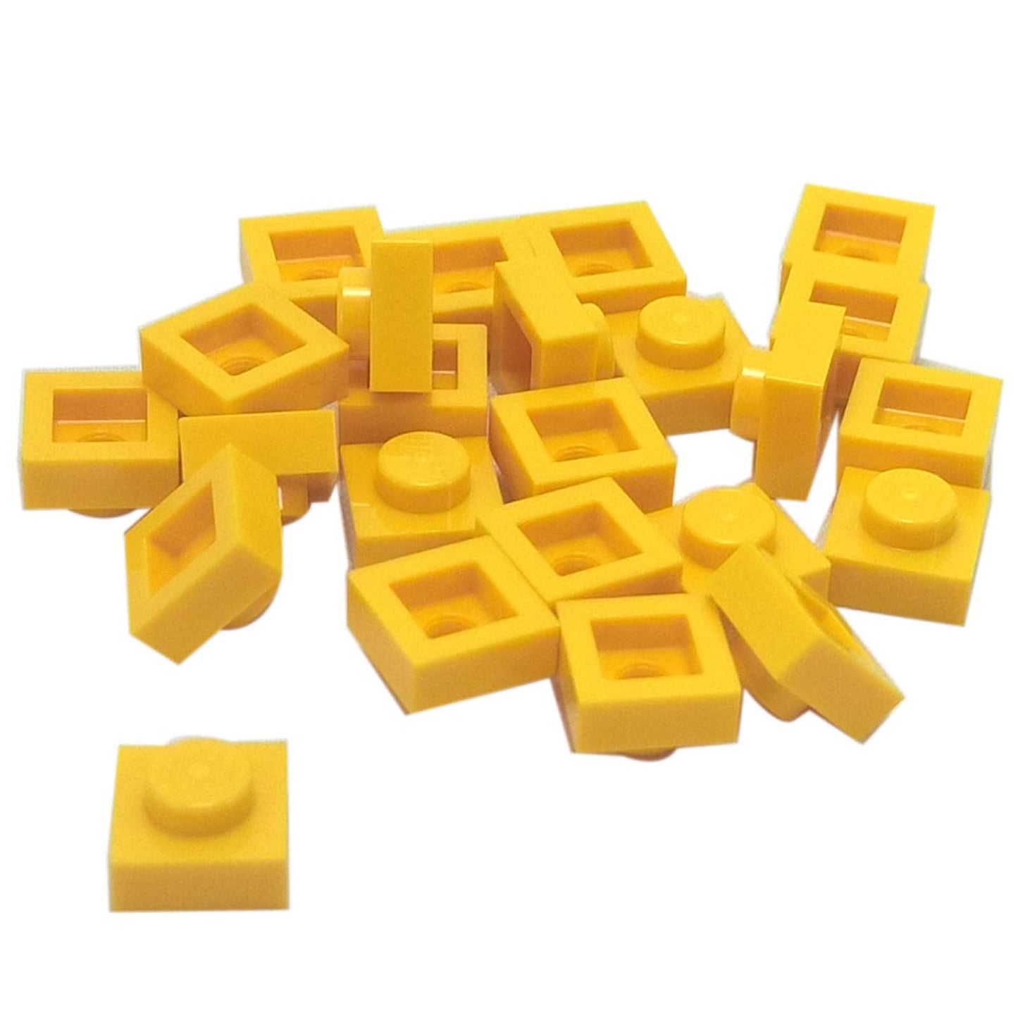 LEGO® Placa 1x1 en amarillo, un elemento básico versátil ideal para detalles, espaciado y conexiones precisas de MOC.
