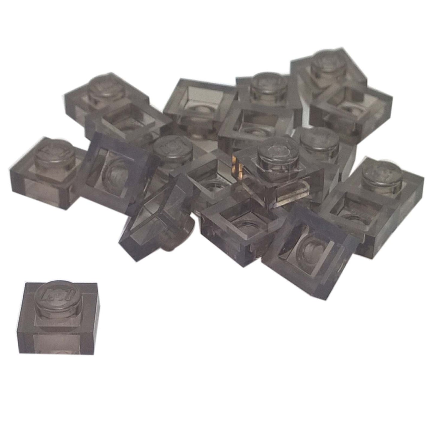 LEGO® Placa 1x1 en negro transparente, un elemento básico versátil ideal para detalles, espaciado y conexiones precisas de MOC.
