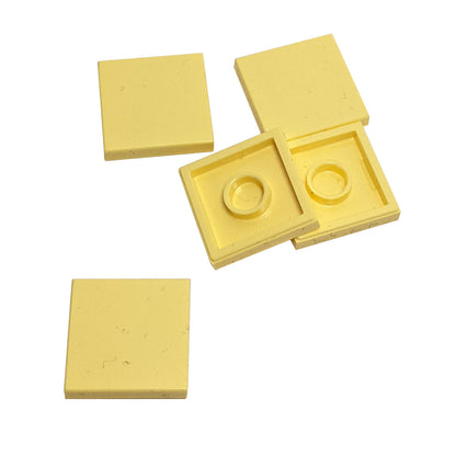 LEGO Tile 2 x 2 part 3068 with smooth square top and underside connection ring bright light yellow