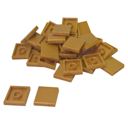 LEGO Tile 2 x 2 part 3068 with smooth square top and underside connection ring pearl gold
