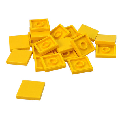 LEGO Tile 2 x 2 part 3068 with smooth square top and underside connection ring yellow