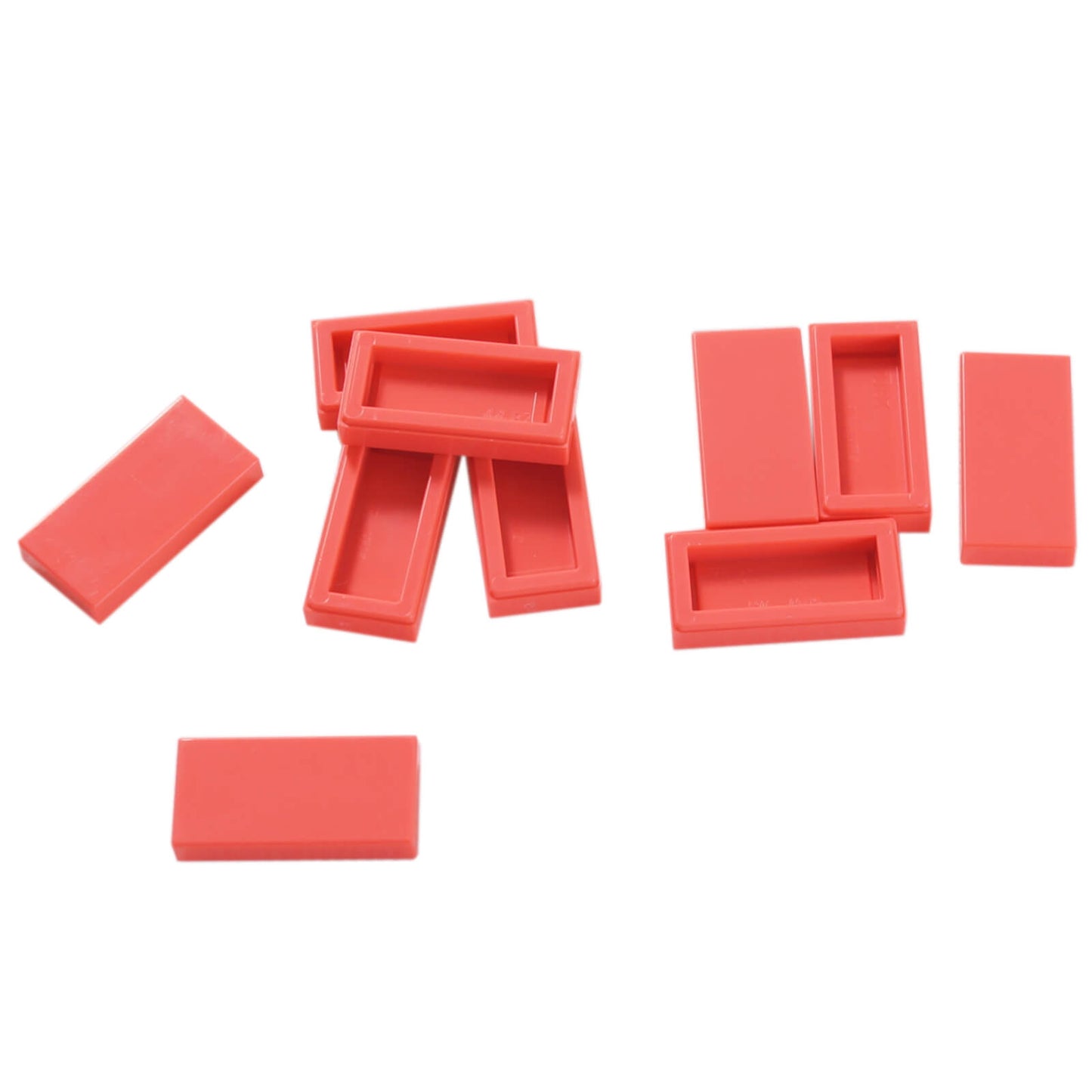 LEGO Tile 1 x 2 part 3069 with smooth rectangular top and recessed underside coral