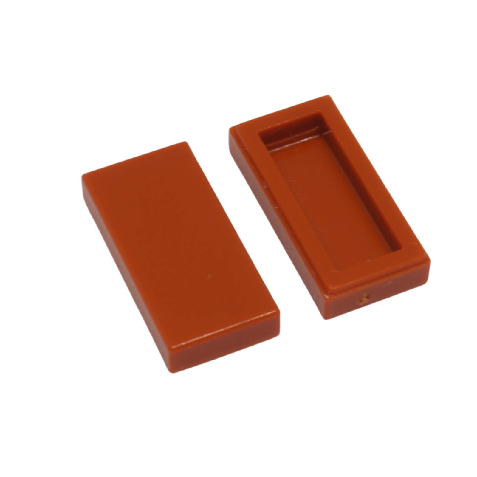 LEGO Tile 1 x 2 part 3069 with smooth rectangular top and recessed underside dark orange