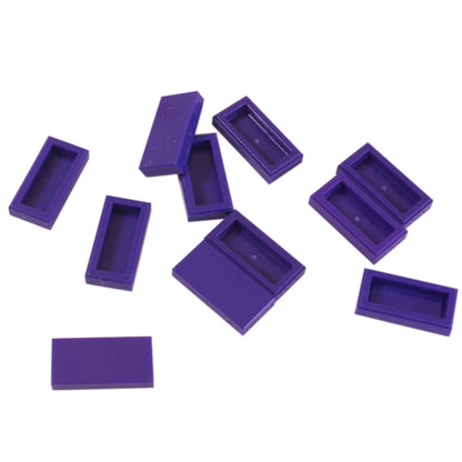 LEGO Tile 1 x 2 part 3069 with smooth rectangular top and recessed underside dark purple