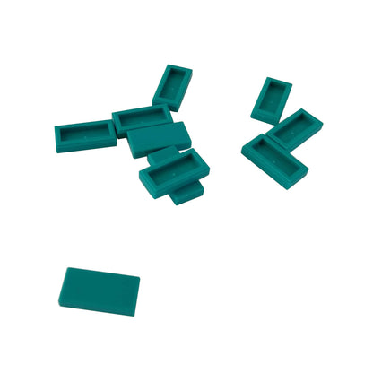 LEGO Tile 1 x 2 part 3069 with smooth rectangular top and recessed underside dark turquoise