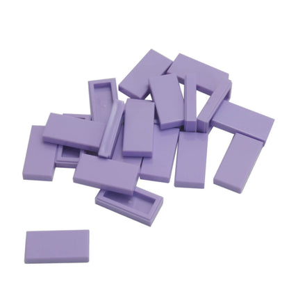 LEGO Tile 1 x 2 part 3069 with smooth rectangular top and recessed underside lavender