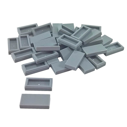 LEGO Tile 1 x 2 part 3069 with smooth rectangular top and recessed underside light bluish gray